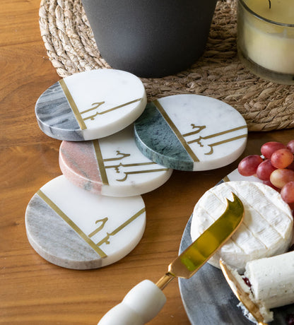 Beautiful pastel colored marble coasters with brass detail in Arabic calligraphy by Kashida