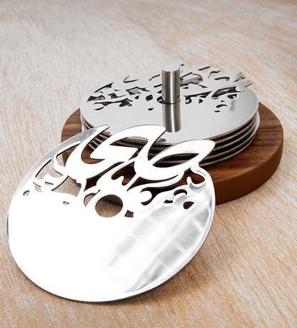 Round silver coasters with wooden base in Arabic calligraphy